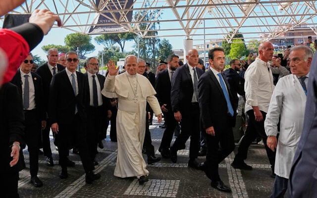 Pope Leo XIV arrives at the Agostino Gemelli Polyclinic in Rome, October 13, 2026, where he’s expected to be operated on to remove a lung nodule. (AP Photo/Alessandra Tarantino)