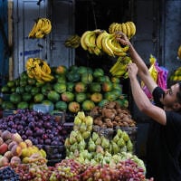 A Palestinian vendor arranges fruit at a market in the Al-Shati refugee camp in Gaza City, October 14, 2026. (AP Photo/Abdel Kareem Hana)