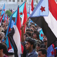 Supporters of the Southern Transitional Council (STC) hold South Yemen flags during a rally to celebrate the 63rd anniversary of the October 14 Revolution against British colonial rule and respond to calls for mobilization against the Houthi rebels in Aden, Yemen, October 14, 2026. (AP Photo/Abdulnasser Alseddik)
