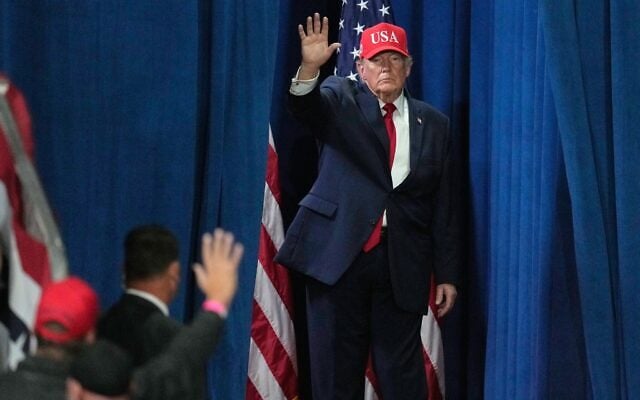 US President Donald Trump departs a campaign rally at Majestic Valley Arena, October 14, 2026, in Kalispell, Montana. (AP Photo/Ross D. Franklin)
