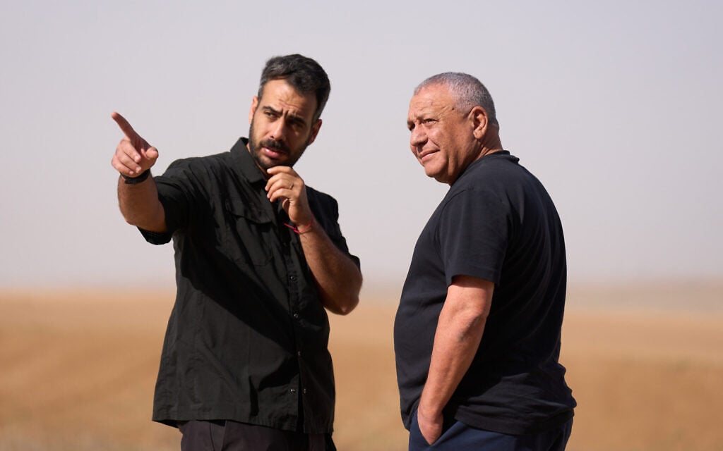 Yashar chair Gadi Eisenkot speaks with his security guard as he prepares to deliver a campaign speech on the Israel-Gaza border, October 15, 2026. (AP Photo/Ariel Schalit) Yashar chair Gadi Eisenkot speaks with his security guard as he prepares to deliver a campaign speech on the Israel-Gaza border, October 15, 2026. (AP Photo/Ariel Schalit)