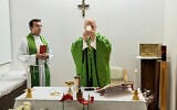 This picture, released by Vatican Media on October 16, 2026, shows Pope Leo XIV, flanked by his personal secretary, Monsignor Edgard Iván Rimaycuna Inga, left, celebrating Mass at the Agostino Gemelli Polyclinic in Rome, where he is recovering after having cancer removed from his right lung. (Vatican Media via AP)
