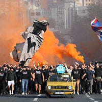 Thousands of members of the Hajduk’s Torcida fan club march toward the stadium ahead of the Conference League soccer match between Hajduk Split and Ajax in Split, Croatia, October 15, 2026. (AP Photo/Ante Cizmic)