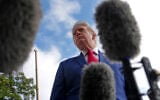 US President Donald Trump speaks with reporters before boarding Marine One on the South Lawn of the White House, October 16, 2026, in Washington. (AP Photo/Julia Demaree Nikhinson)