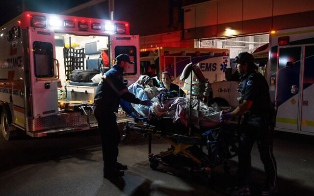 Paramedics load an injured person into an ambulance at the Wainwright Health center after a fire at Canadian Forces Base Wainwright, outside of Wainwright, Alberta October 17, 2026. (John Ulan/ The Canadian Press via AP) Paramedics load an injured person into an ambulance at the Wainwright Health center after a fire at Canadian Forces Base Wainwright, outside of Wainwright, Alberta October 17, 2026. (John Ulan/ The Canadian Press via AP)