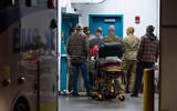 Emergency crews and military personnel are seen at the Wainwright Health Centre as injured military members are treated after a fire at Canadian Forces Base Wainwright, outside of Wainwright, Alberta October 17, 2026. (John Ulan/The Canadian Press via AP)