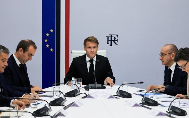 France’s President Emmanuel Macron, center, hosts an Interministerial Crisis Meeting at the Elysee Presidential Palace, in Paris, on October 18, 2026, the day after nationwide riots. (Ludovic Marin/ Pool Photo via AP) France’s President Emmanuel Macron, center, hosts an Interministerial Crisis Meeting at the Elysee Presidential Palace, in Paris, on October 18, 2026, the day after nationwide riots. (Ludovic Marin/ Pool Photo via AP)
