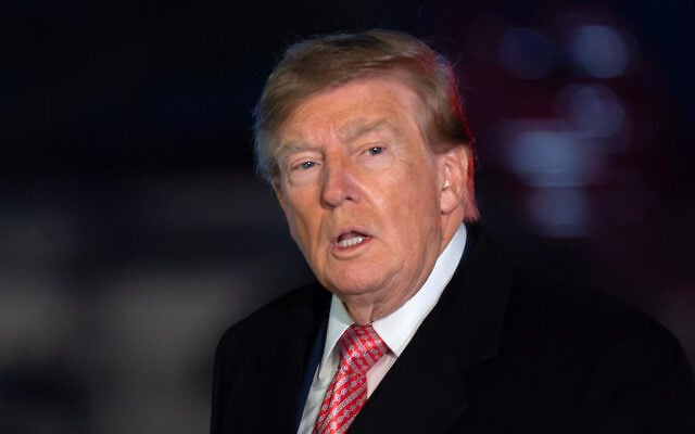 US President Donald Trump talks to reporters as he walks on the South Lawn upon his arrival to the White House, October 18, 2026, in Washington. (AP Photo/Jose Luis Magana)