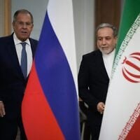 Iranian Foreign Minister Abbas Araghchi, right, and Russian Foreign Minister Sergey Lavrov arrive for a news conference after their meeting at Iran’s Foreign Ministry in Tehran, Iran, October 19, 2026. (Vahid Salemi/AP)