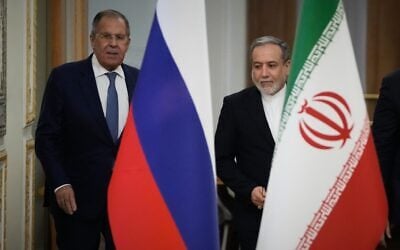Iranian Foreign Minister Abbas Araghchi, right, and Russian Foreign Minister Sergey Lavrov arrive for a news conference after their meeting at Iran’s Foreign Ministry in Tehran, Iran, October 19, 2026. (Vahid Salemi/AP)