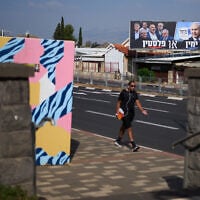An election campaign billboard featuring Prime Minister Benjamin Netanyahu, leader of the Likud party, and other politicians hangs in Kiryat Shmona, Israel’s largest northern city, near Lebanon’s border, ahead of the country’s general election, October 13, 2026. (AP Photo/Ariel Schalit)