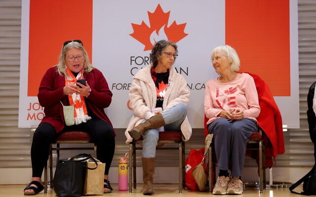 Supporters wait for results at the pro-Canada watch party in Edmonton, Alberta October 19, 2026. (James Maclennan/The Canadian Press via AP)