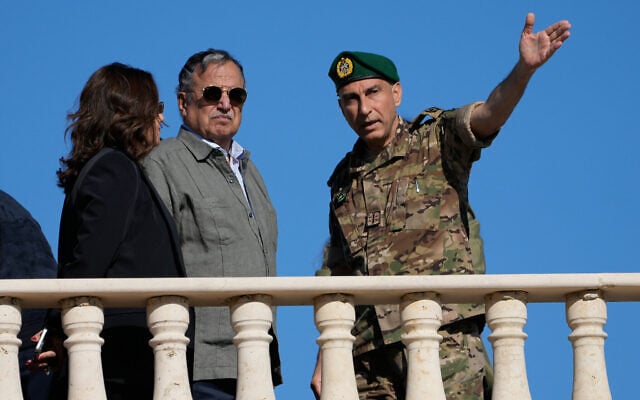Arab League Secretary-General Nabil Fahmy, center, listens to a Lebanese army officer pointing out villages occupied by Israeli forces in Zawtar al-Gharbiyeh, southern Lebanon, October 20, 2026. (AP Photo/Hussein Malla)