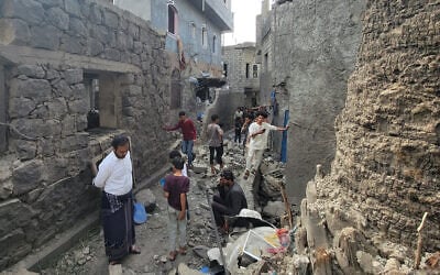 Residents inspect debris of their homes after a missile strike in Seina, Taiz, Yemen, October 20, 2026. (AP Photo/Marzouq Al Jabri)