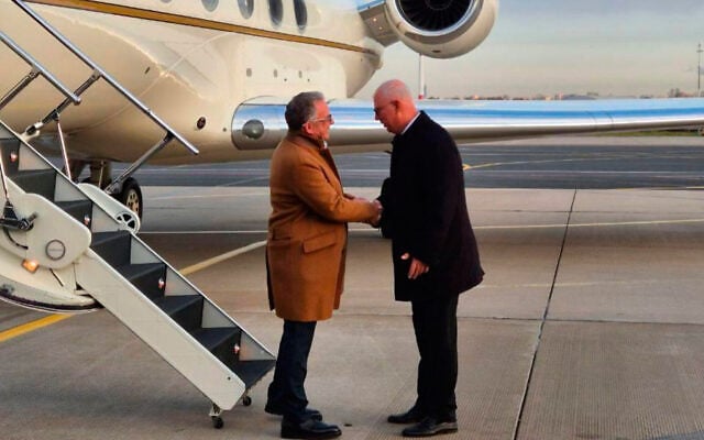 Russian presidential envoy Kirill Dmitriev, right, greets US special envoy Steve Witkoff at the international airport outside St. Petersburg, Russia, October 21, 2026. (TASS Photo via AP)