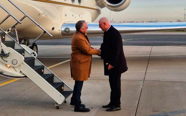 Russian presidential envoy Kirill Dmitriev, right, greets US special envoy Steve Witkoff at the international airport outside St. Petersburg, Russia, October 21, 2026. (TASS Photo via AP)
