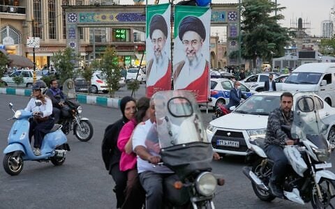Motorists ride past portraits of Iran’s Supreme Leader Mojtaba Khamenei in Tehran, Iran, October 21, 2026. (AP Photo/Vahid Salemi)