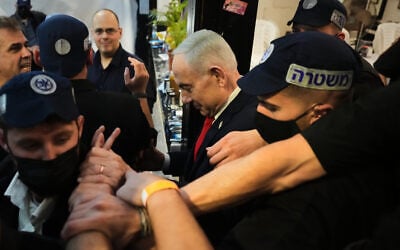 Prime Minister Benjamin Netanyahu, leader of the Likud party, arrives surrounded by police for a campaign at a market in Tel Aviv, Israel, October 22, 2026, ahead of the country’s general election. (Ariel Schalit/AP) Prime Minister Benjamin Netanyahu, leader of the Likud party, arrives surrounded by police for a campaign at a market in Tel Aviv, Israel, October 22, 2026, ahead of the country’s general election. (Ariel Schalit/AP)