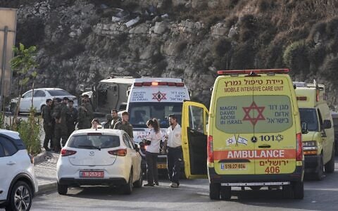 Israeli soldiers and emergency personnel gather near ambulances following a shooting attack near Yehuda Junction, near Hebron, in the West Bank, October 23, 2026. (AP Photo/Mahmoud Illean)
