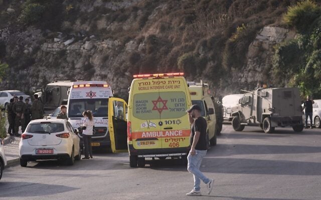 Israeli soldiers and emergency personnel gather near ambulances following a shooting attack near Yehuda Junction, near Hebron, in the West Bank, October 23, 2026. (AP Photo/Mahmoud Illean)