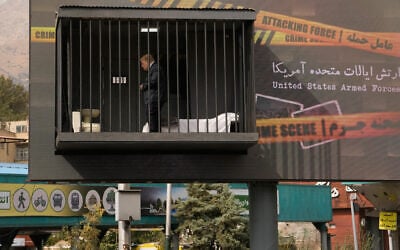 An actor portraying US President Donald Trump walks behind bars in a billboard installation resembling a prison cell in Tajrish Square in Tehran, Iran, October 23, 2026. (AP Photo/Vahid Salemi) An actor portraying US President Donald Trump walks behind bars in a billboard installation resembling a prison cell in Tajrish Square in Tehran, Iran, October 23, 2026. (AP Photo/Vahid Salemi)