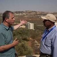 US Democratic congressional candidate Brad Lander (left) speaks with Yasser Alqam (right), spokesperson of the Turmus Ayya municipality, while visiting the West Bank town, October 23, 2026. (AP/Leo Correa)