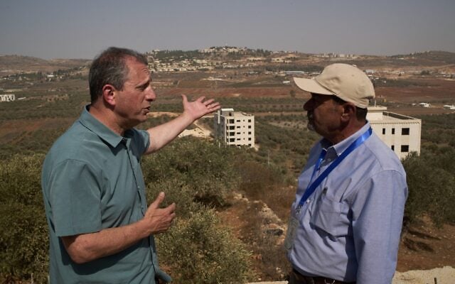 US Democratic congressional candidate Brad Lander (left) speaks with Yasser Alqam (right), spokesperson of the Turmus Ayya municipality, while visiting the West Bank town, October 23, 2026. (AP/Leo Correa)