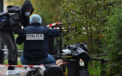 Forensic investigators search for evidence after a shooting in Trappes, outside Paris, October 23, 2026. (AP Photo/Emma Da Silva) Forensic investigators search for evidence after a shooting in Trappes, outside Paris, October 23, 2026. (AP Photo/Emma Da Silva)