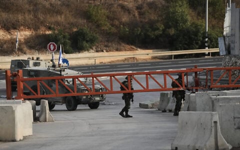 Israeli soldiers close a gate to vehicles during an army operation in Hebron, in the West Bank, October 24, 2026, a day after a Palestinian shooting attack in the area. (AP Photo/Mahmoud Illean)