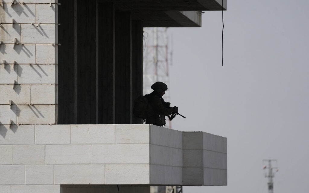 Israeli soldiers take up positions during an army operation in the West Bank city of Hebron October 24, 2026. (AP Photo/Mahmoud Illean) Israeli soldiers take up positions during an army operation in the West Bank city of Hebron October 24, 2026. (AP Photo/Mahmoud Illean)
