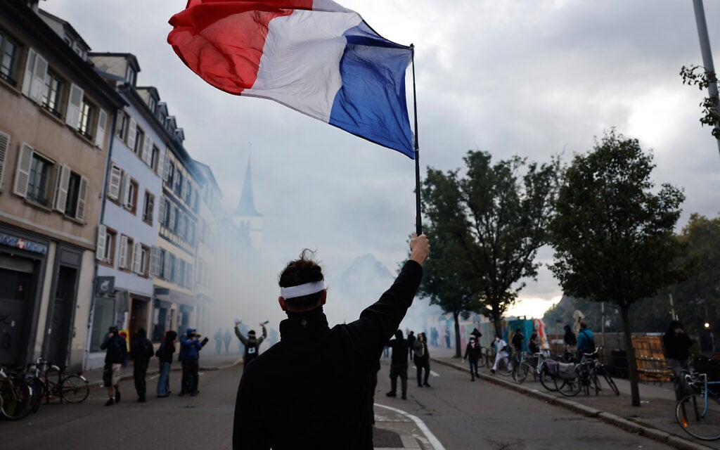More than 400,000 protest across France, challenging Macron as clashes erupt in Paris