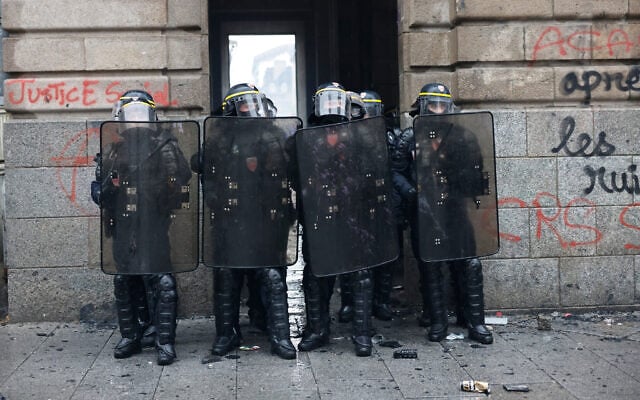 French policemen stand guard after a demonstration against rising living costs in Rennes, France, October 24, 2026. (AP Photo/Jeremias Gonzalez) French policemen stand guard after a demonstration against rising living costs in Rennes, France, October 24, 2026. (AP Photo/Jeremias Gonzalez)