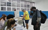 Voters wait to cast their ballots during a presidential runoff in Rio de Janeiro, Brazil, October 25, 2026. (AP Photo/Lucas Landau)