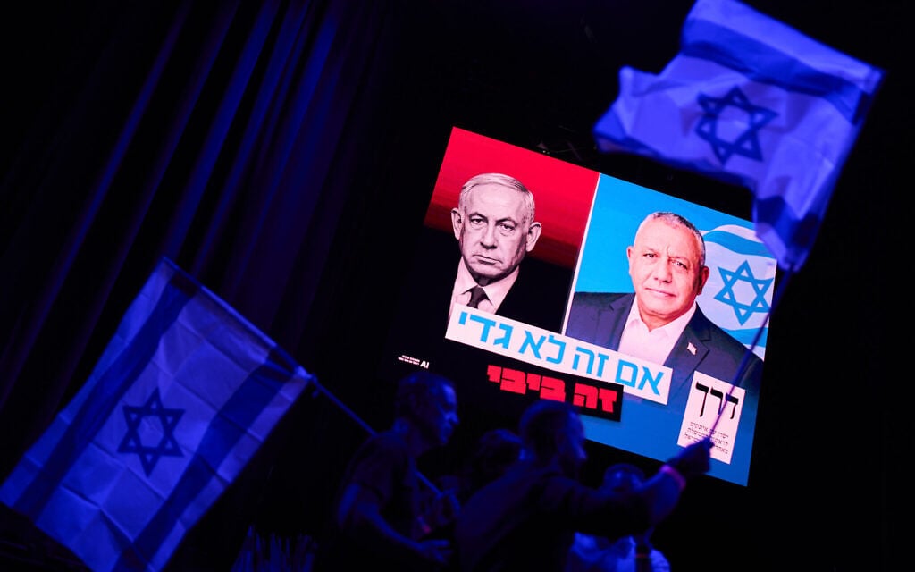 A screen projects an image of Israeli Prime Minister Benjamin Netanyahu, left, and his main rival, opposition candidate Gadi Eisenkot, leader of the Yashar party, during a campaign rally for Eisenkot ahead of Israel’s general election, October 25, 2026, in Tel Aviv, Israel. (AP Photo/David Goldman) A screen projects an image of Israeli Prime Minister Benjamin Netanyahu, left, and his main rival, opposition candidate Gadi Eisenkot, leader of the Yashar party, during a campaign rally for Eisenkot ahead of Israel’s general election, October 25, 2026, in Tel Aviv, Israel. (AP Photo/David Goldman)