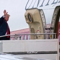 US President Donald Trump waves as he boards Air Force One, October 25, 2026, at Selfridge Air National Guard Base, Mich. (AP Photo/Julia Demaree Nikhinson)
