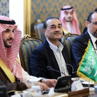 Pakistan’s Army Chief Field Marshal Gen. Asim Munir, center, Ibrahim Kalin, the head of Turkey’s intelligence service, right, and Saudi Arabia’s Defense Minister Khalid bin Salman, left, attend a meeting of high-level delegations from Saudi Arabia, Pakistan and Turkey with senior Iranian officials in Tehran, Iran, October 26, 2026. (Iranian Presidency Office via AP)