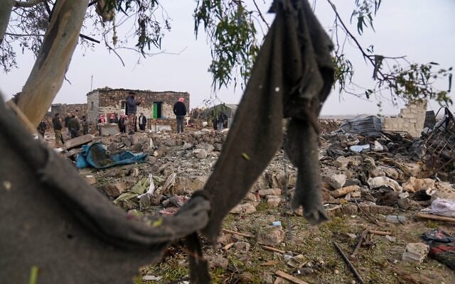 Men inspect the aftermath of a Jordanian airstrike in Al-Tuff, in the countryside of Daraa province in southern Syria, October 27, 2026. (AP Photo/Ghaith Alsayed) Men inspect the aftermath of a Jordanian airstrike in Al-Tuff, in the countryside of Daraa province in southern Syria, October 27, 2026. (AP Photo/Ghaith Alsayed)