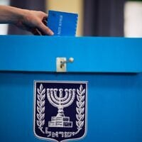 A voter casts his ballot at a school used as a polling station during Israel’s general election in Tel Aviv, October 27, 2026. (AP/David Goldman)