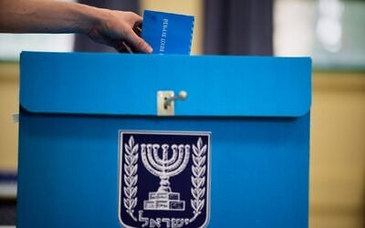 A voter casts his ballot at a school used as a polling station during Israel’s general election in Tel Aviv, October 27, 2026. (AP/David Goldman) A voter casts his ballot at a school used as a polling station during Israel’s general election in Tel Aviv, October 27, 2026. (AP/David Goldman)