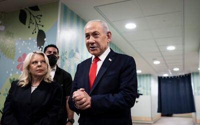 Prime Minister Benjamin Netanyahu speaks to the media as he stands next to his wife Sara after voting at a polling station in Jerusalem, October 27, 2026. (Jewel Samad/Pool Photo via AP) Prime Minister Benjamin Netanyahu speaks to the media as he stands next to his wife Sara after voting at a polling station in Jerusalem, October 27, 2026. (Jewel Samad/Pool Photo via AP)