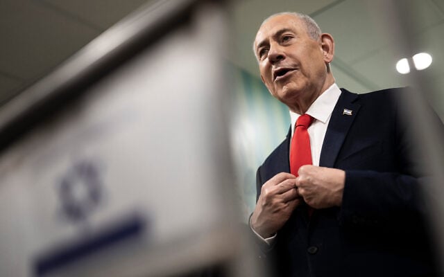 Prime Minister Benjamin Netanyahu speaks to the media after voting at a polling station in Jerusalem, October 27, 2026. (Jewel Samad/Pool Photo via AP)
