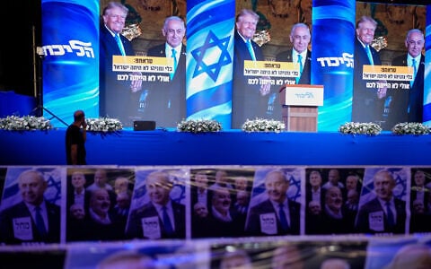 A video wall displays images of Benjamin Netanyahu with US President Donald Trump at a Likud election night event in Jerusalem, October 27, 2026. (AP Photo/David Goldman)