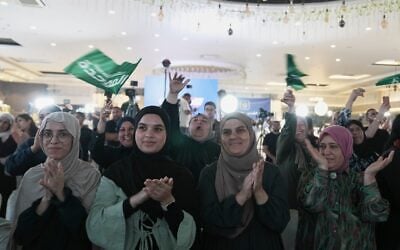 Supporters of Israeli lawmaker Mansour Abbas’s Raam party applaud and wave party flags after the release of the first exit poll results in Israel’s general election, in Sakhnin, Israel, October 27, 2026. (AP Photo/Mahmoud Illean) Supporters of Israeli lawmaker Mansour Abbas’s Raam party applaud and wave party flags after the release of the first exit poll results in Israel’s general election, in Sakhnin, Israel, October 27, 2026. (AP Photo/Mahmoud Illean)
