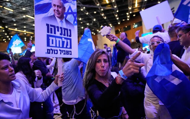 Supporters of Israeli Prime Minister Benjamin Netanyahu celebrate at Likud party headquarters in Jerusalem following the release of the first exit poll results in Israel’s general election October 28, 2026. (AP Photo/Ohad Zwigenberg)