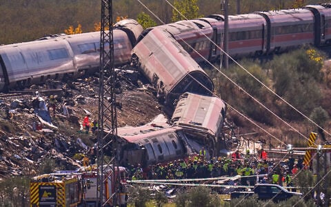 Emergency services work at the scene of a collision between two trains in Urda, Spain, on October 28, 2026. (AP Photo/Manu Fernandez)