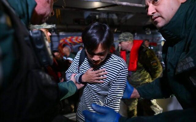 A crew member of the Liberian-flagged container ship Contship Jet, which was attacked by drones, is evacuated and transported to the port of Varna, Bulgaria, aboard the Bulgarian Navy rescue ship “Proteo”, late October 28, 2026. (AP Photo/Petko Momchilov)