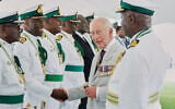 Britain’s King Charles III meets officers at the Royal Bahamas Defence Force Base in Nassau, Bahamas, October 28, 2026. (AP Photo/Tim Aylen)