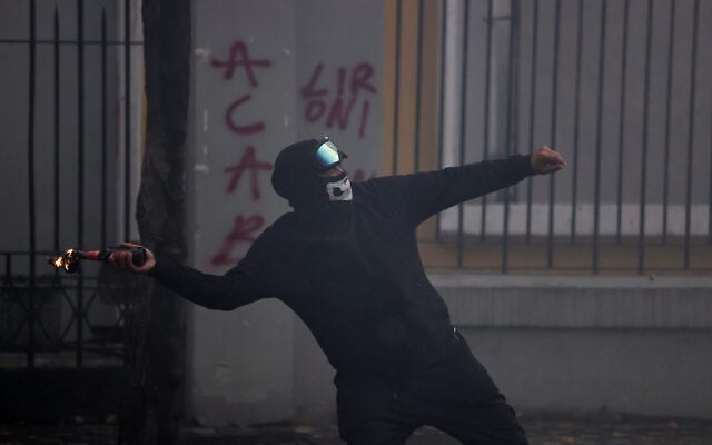 A protester throws a petrol bomb at police during an anti-government rally, in Tirana, Albania, October 31, 2026. (AP Photo/Hameraldi Agolli) A protester throws a petrol bomb at police during an anti-government rally, in Tirana, Albania, October 31, 2026. (AP Photo/Hameraldi Agolli)
