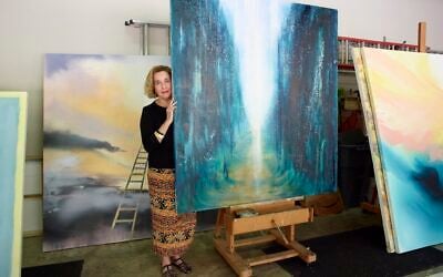 Barbara Hines with one of her paintings in Jerusalem. (Courtesy/Tom DuBrock) Barbara Hines with one of her paintings in Jerusalem. (Courtesy/Tom DuBrock)