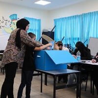 Arab Israelis cast their vote at a voting station in Tayibe, during the Knesset elections, on November 1, 2022. (Jamal Awad/ Flash90/ File)